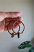 copper hoop earrings with a quartz point