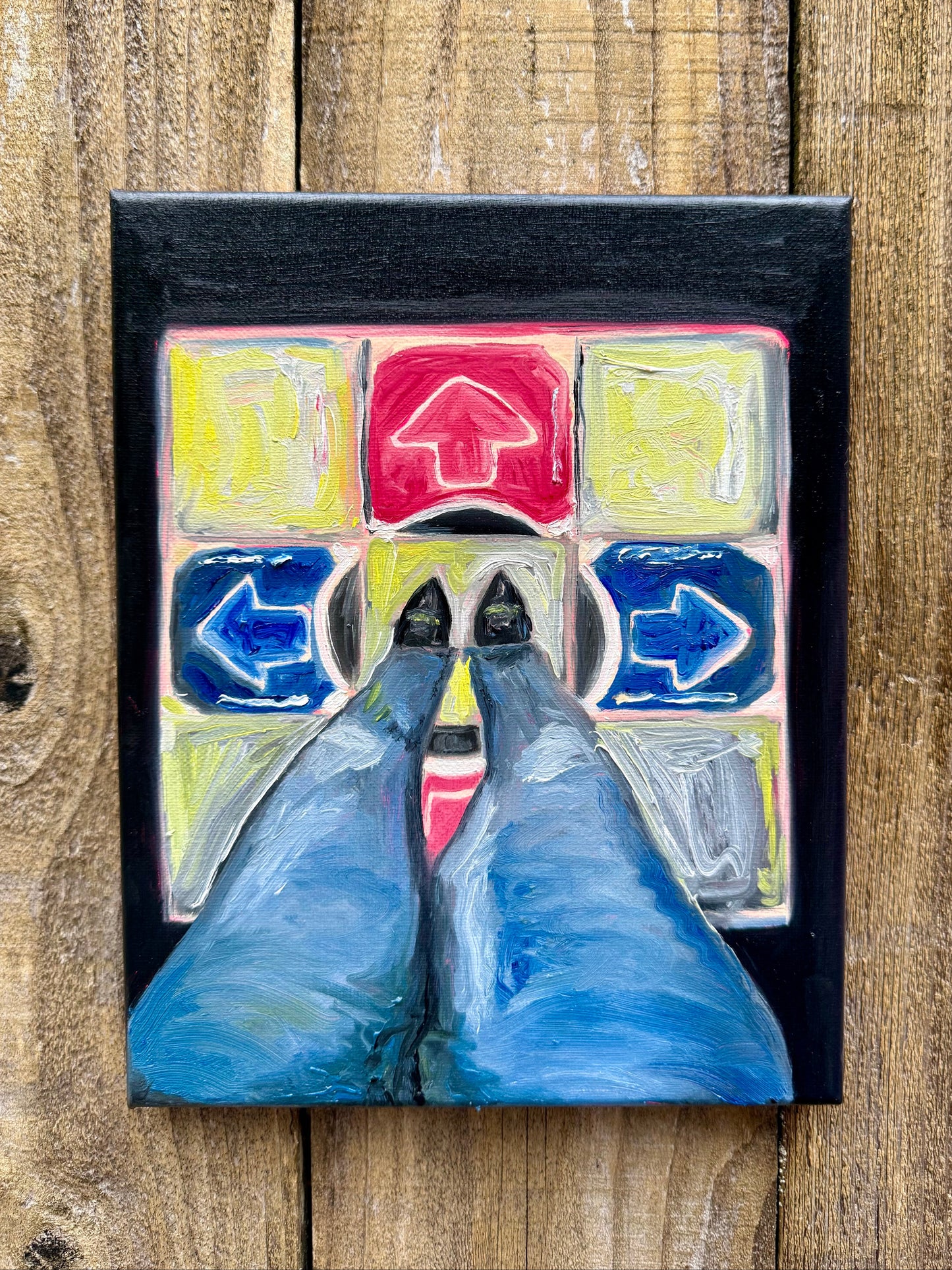 POV of a girl standing on a dance dance revolution mat from the early 2000's