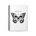 minimalist white journal with a butterfly skull design